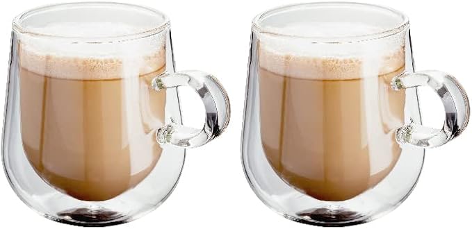 Two clear glass cups filled with layers of coffee and frothy milk.