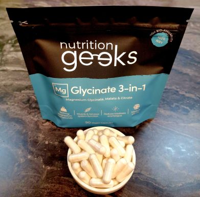 A bag of Glycinate 3-in-1 dietary supplement with capsules in a bowl.