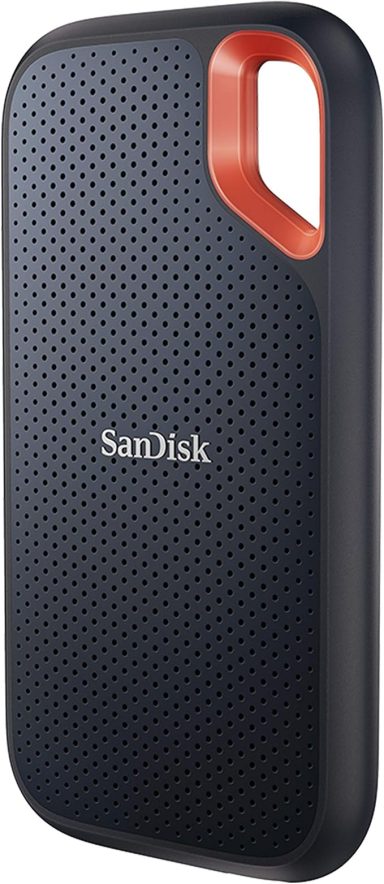 Black SanDisk portable SSD with an orange accent and textured surface.