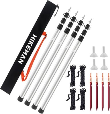 A set of four adjustable trekking poles with a carrying bag and accessories.