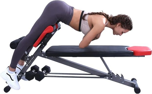 Woman performing an exercise on a bench, leaning forward with arms resting on the bench.