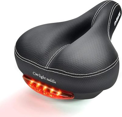 Black bike seat with a textured surface and built-in red LED lights at the back.