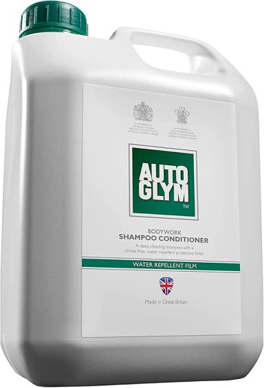 White plastic container of car shampoo with a green cap and label.