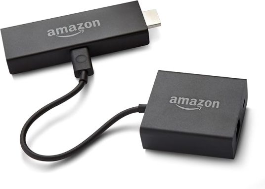 Amazon Fire TV Stick with USB connector and power adapter.