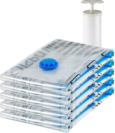 A stack of vacuum-storage bags with a hand pump for air removal.