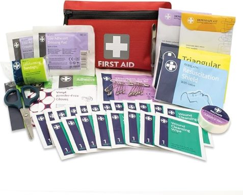 A first aid kit with various medical supplies in a red pouch.