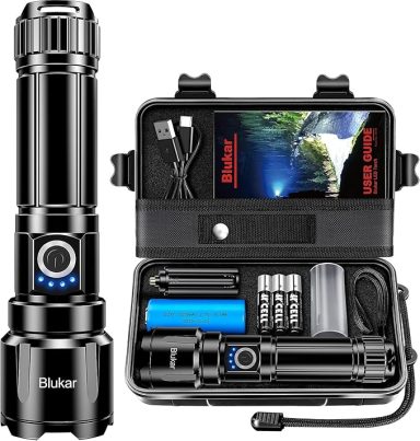 Black flashlight with charger, battery, and accessories in a protective case.
