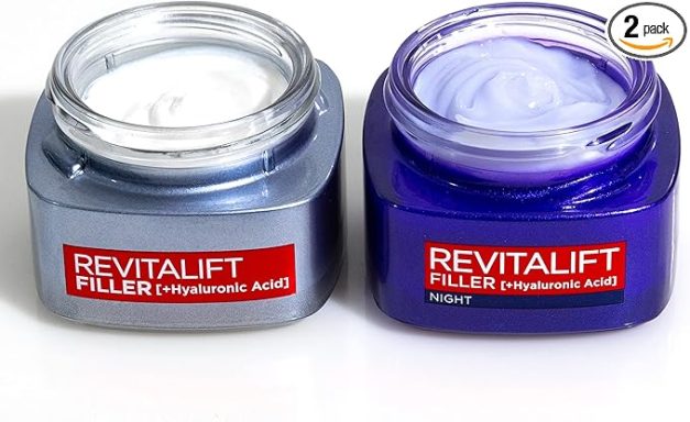 Two jars of skincare creams, one silver and one purple, both labelled Revitalift Filler.