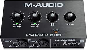 Black audio interface with four knobs and two input ports for recording musicians.