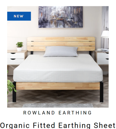 Organic fitted earthing sheet on a bed with wooden headboard and bedside tables.